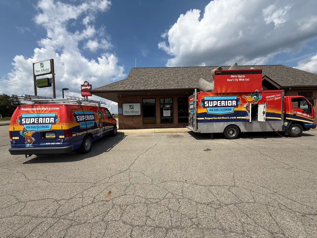 Superior's dryer vent van and duct truck on-site at a commercial building