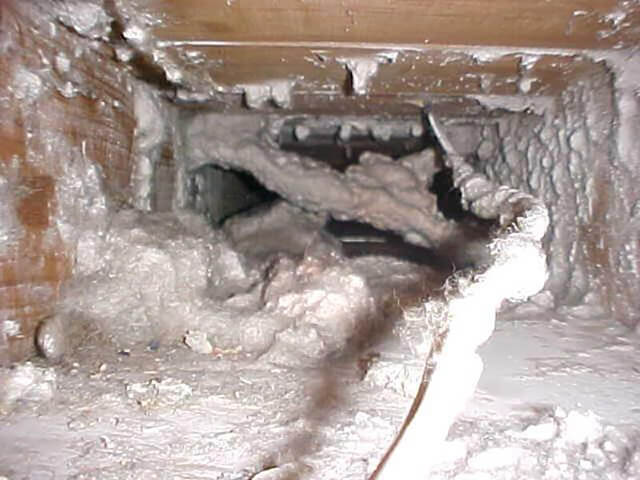 Before photo of a very dirty residential air duct